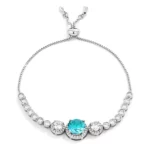 Adjustable Rhodium Plated Graduated Aqua CZ Bolo Style Tennis Bracelet